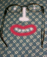 Eyeglasses with painted face.