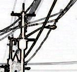 Poles and wires against the sky.
