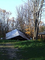 Intact metal roof of collapsed building.