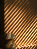 striped sunlight falling on the pine hutch